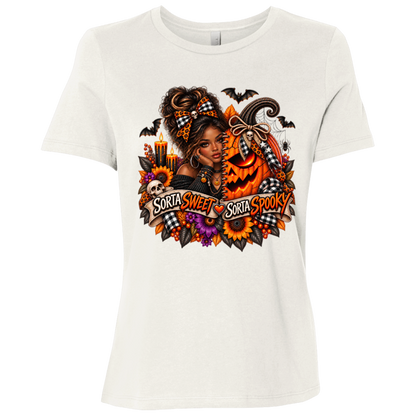 A Vintage White T-Shirt featuring an African American woman in a glamorous Halloween scene surrounded by a decorated jack-o'-lantern, sunflowers, autumn flowers, candles, bats, skulls, and spiderwebs, with a decorative banner reading “Sorta Sweet Sorta Spooky” on a transparent background