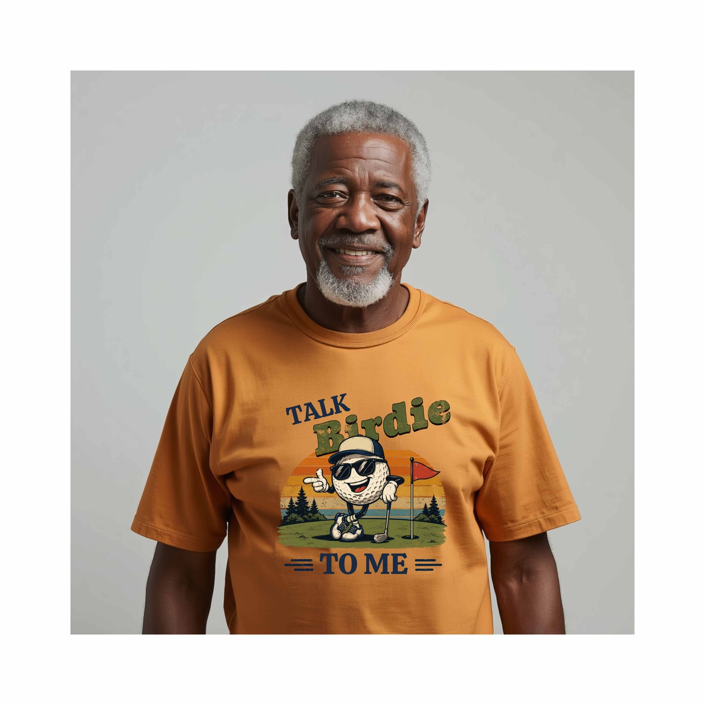AI Generated African American older man wearing a mustard yellow t-shirt with a graphic design and text "Talk Birdie To Me" t-shirt featuring a cool cartoon golf ball rocking sunglasses on the green  leaning on a golf club and next to a putting hole with a flag inside of the hole with  a retro sunset background