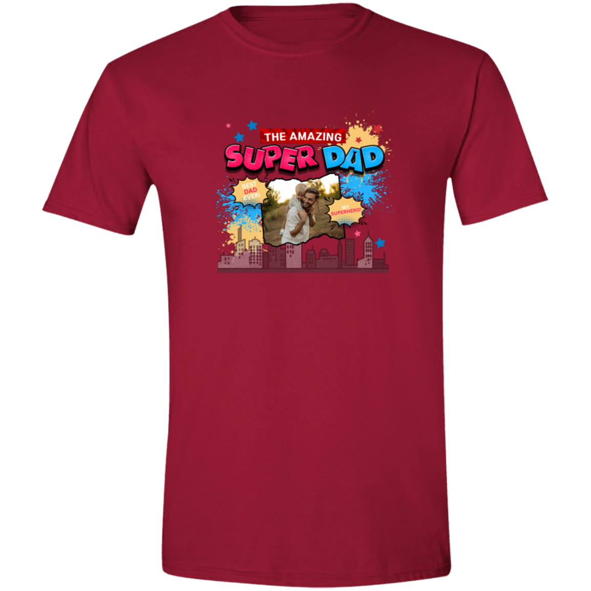 Cardinal Red t-shirt with 'The Amazing Super Dad' graphic and featuring eye-catching pop art elements, city skyline graphics, comic-style bursts, and a personalized photo placement of a man and child on a plain background