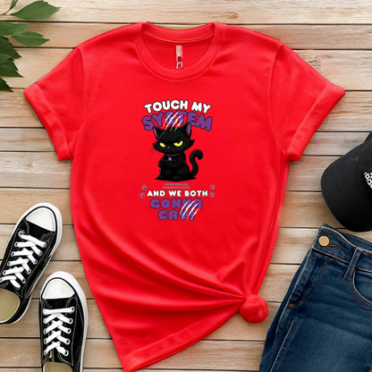 Red t-shirt which graphic features an adorably furious black cat with glowing eyes and the  message 'Touch My System And We Both Gonna Cry!', includes "System Error 404 and Patience Not Found' that's equal parts funny, relatable on a wooden surface with shoes and jeans.