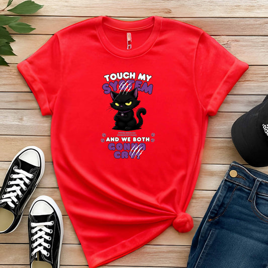 Red t-shirt which graphic features an adorably furious black cat with glowing eyes and the  message 'Touch My System And We Both Gonna Cry!', includes "System Error 404 and Patience Not Found' that's equal parts funny, relatable on a wooden surface with shoes and jeans.