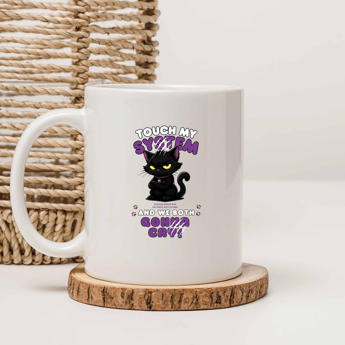 White mug with a black cat graphic and text message 'Touch My System And We Both Gonna Cry!', includes "System Error 404 and Patience Not Found' that's equal parts funny, relatable on a wooden coaster with a woven basket background