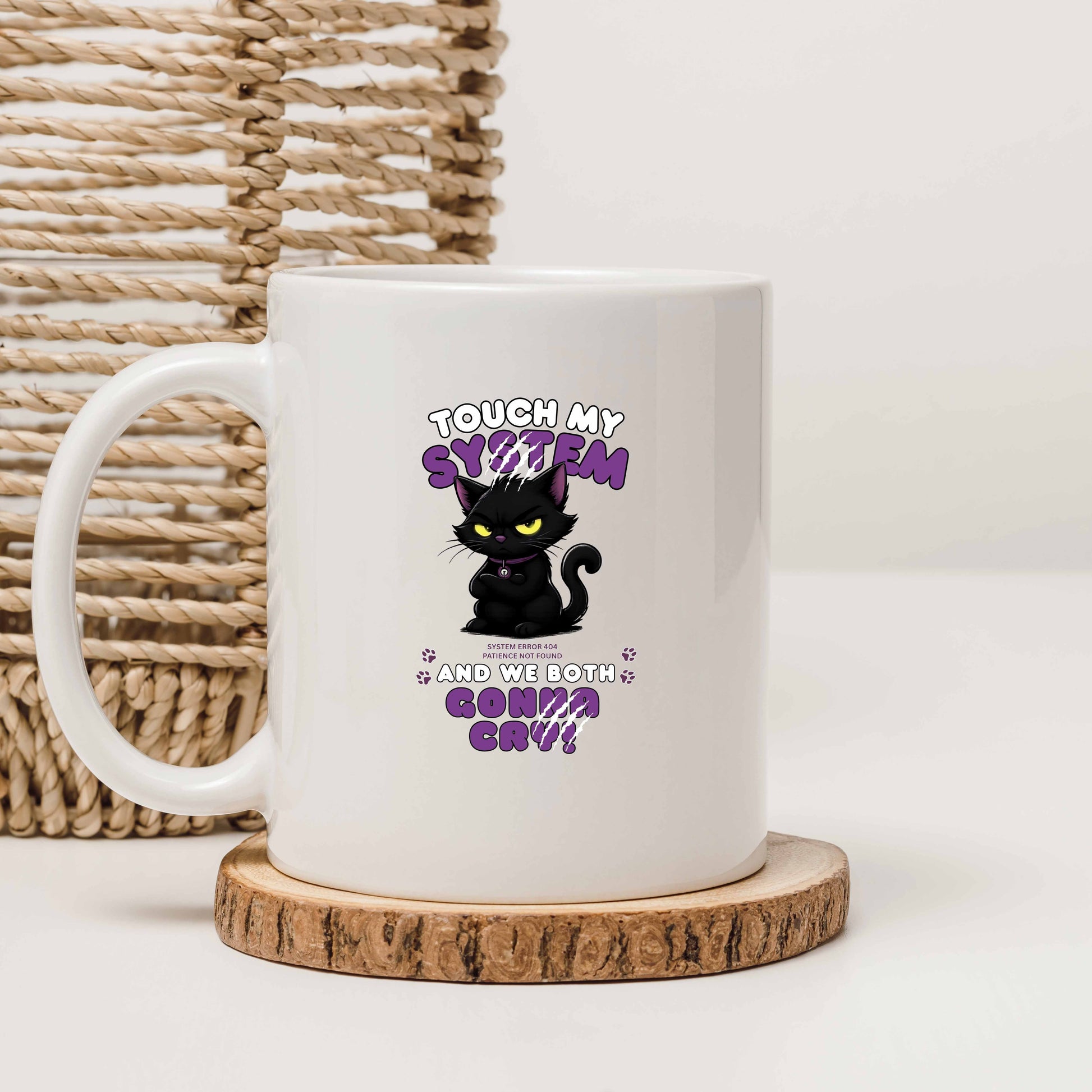 White mug with a black cat graphic and text message 'Touch My System And We Both Gonna Cry!', includes "System Error 404 and Patience Not Found' that's equal parts funny, relatable on a wooden coaster with a woven basket background