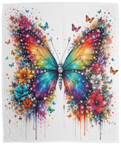 A cream-colored blanket featuring a vibrant, colorful butterfly design surrounded by watercolor-style flowers and paint drips, set against a transparent background