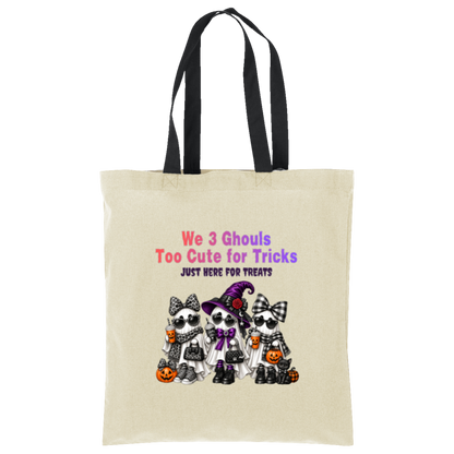 Natural with black straps bag with three cute ghost friends wearing Halloween accessories with leopard print, buffalo plaid, sunglasses, bows, and a purple witch hat, with orange and purple lettering reading “We 3 Ghouls Too Cute for Tricks” and “Just Here for Treats” on a transparent background