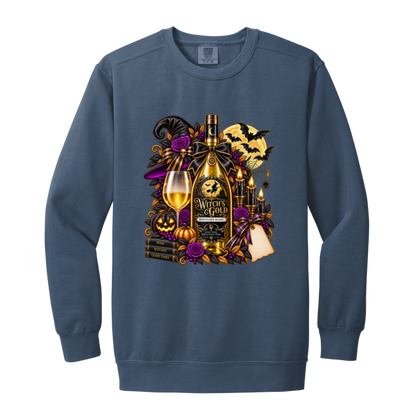 Blue Jean sweatshirt with an elegant gothic Halloween design featuring an ornate golden bottle labeled “Witch's Gold,” surrounded by purple roses, black foliage, pumpkins, glowing candles, bats, spiderwebs, a witch hat, moon, and black-and-purple decorative ribbons on a transparent background