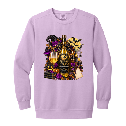 Orchid sweatshirt with an elegant gothic Halloween design featuring an ornate golden bottle labeled “Witch's Gold,” surrounded by purple roses, black foliage, pumpkins, glowing candles, bats, spiderwebs, a witch hat, moon, and black-and-purple decorative ribbons on a transparent background